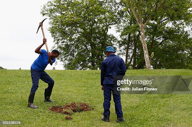 Groundsmen dig a hole in preparations for Alastair Cook and Joe Root of England to plant a tree each after scoring their centuries, a honour given to...