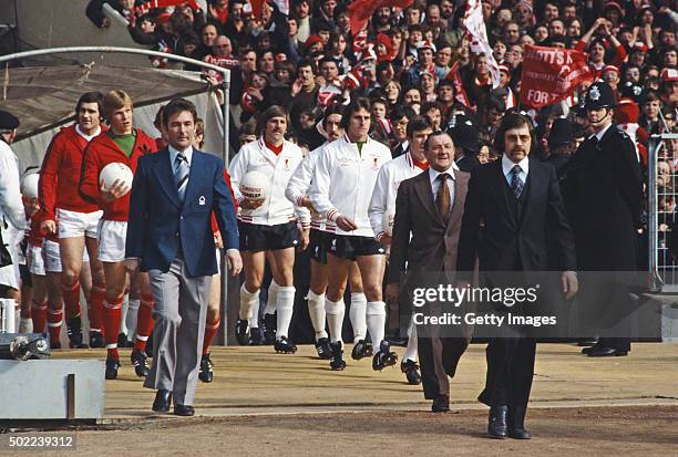 Nottingham Forest manager Brian Clough leads out his team as Liverpool boss Bob Paisley does likewise before the start of the 1978 League Cup Final...