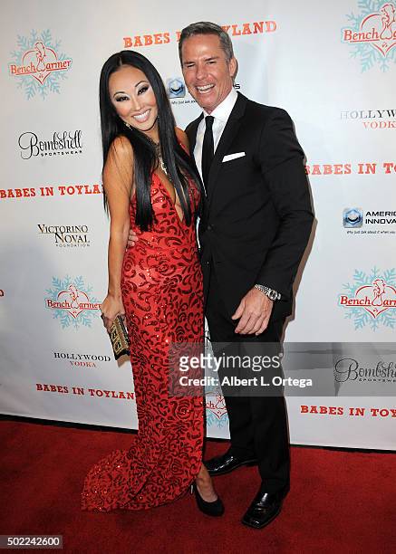 Actress/model Candice Kita and businessman Douglas Jeffery arrive for the 2015 Babes In Toyland And BenchWarmer Charity Toy Drive held at Avalon on...