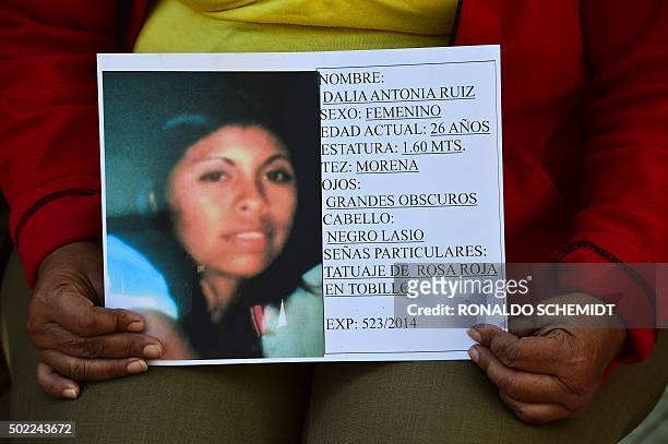 Alma Miriam Ruiz, mother of Dalia, a woman from San Fernando, Tamaulipas State, missing since 2010, shows a pictue of her daughter during an...