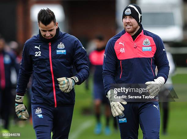 Goalkeepers Karl Darlow and Rob Elliot walk out on the pitch during the Newcastle United Training session at The Newcastle United Training Centre on...