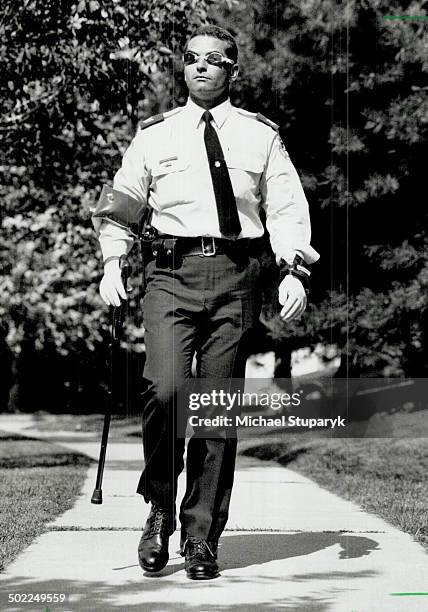 In their shoes: Sergeant Steve Carroll walks a mile in the shoes of the disabled and elderly.