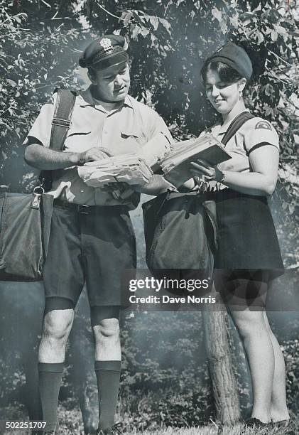 The new look for posties; Postman David Dorge wears shorts on his route today, now that Postmaster-General Andre Ouellet has given them his approval...