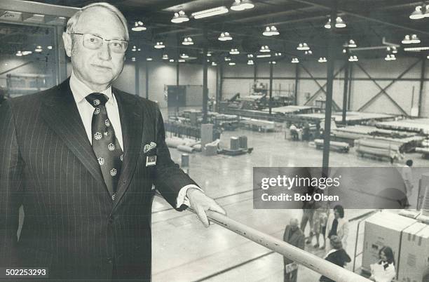 Mammoth warehouse in Scarborough is surveyed by G. Allan Burton, chairman of Simpsons Ltd., who told shareholders at the annual meeting yesterday...