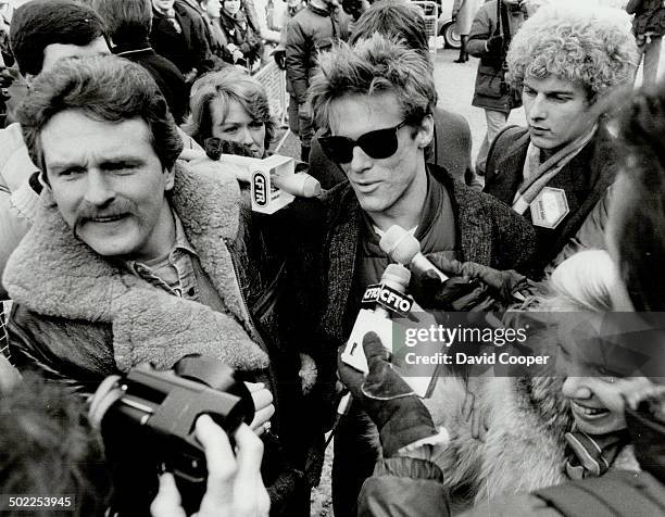 Mob scene: Canadian pop star Bryan Adams , who wrote lyrics for Tears Are Not Enough, is mobbed by fans and media as he enters a Toronto recording...