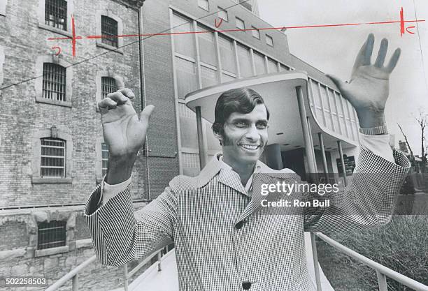 Happy to be free; Desmond Prashad; a 29-year-old immigrant from Guyana; gestures with joy as he leaves the Toronto Jail where he spent nearly seven...