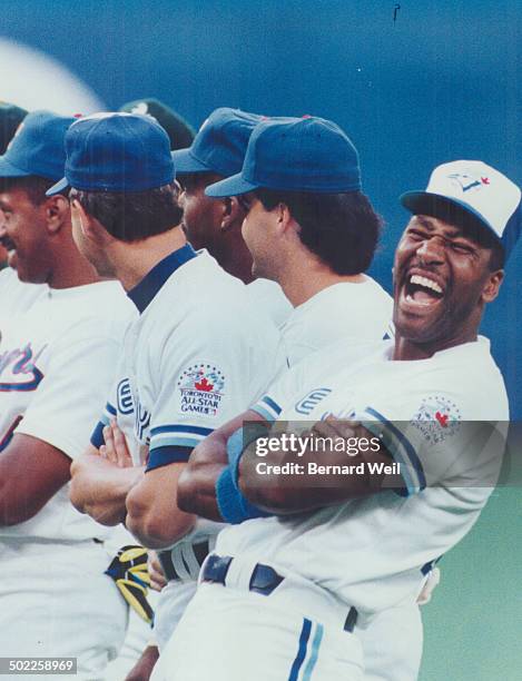 Jolly Joe: Blue Jay outfielder Joe Carter erupts in laughter after a slight snafu over the introduction of him and teammate Jimmy Key before the...