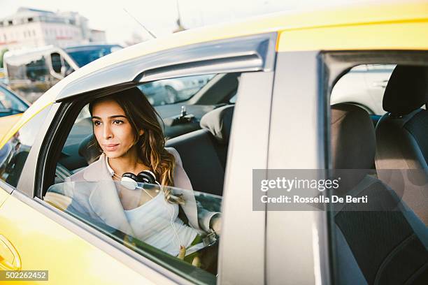 portrait of a successful businesswoman in a taxi using tablet - taxi worried bildbanksfoton och bilder