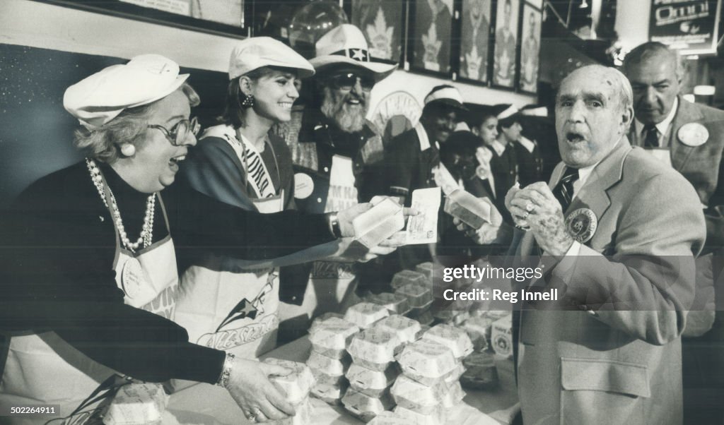 Toronto Maple Leafs vice-president King Clancy put the bite on a Big Mac yesterday at the Gardens to