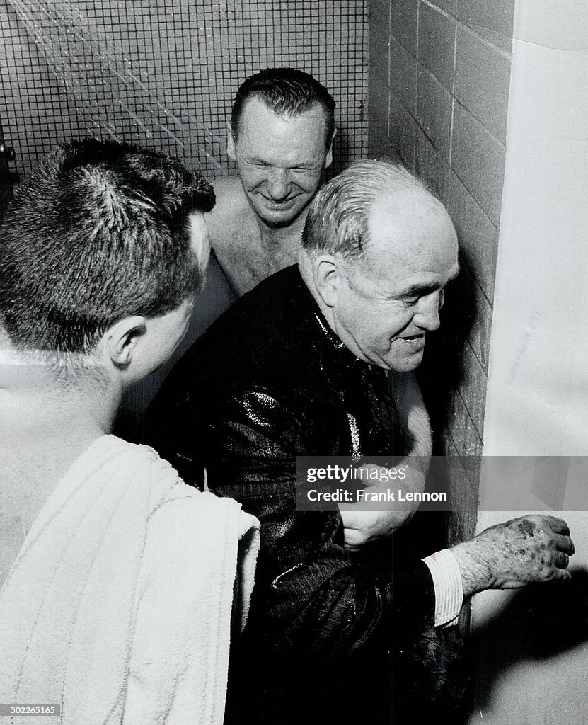 The party wasn't dry. King Clancy gets the traditional dousing in the showers as Leafs celebrate the
