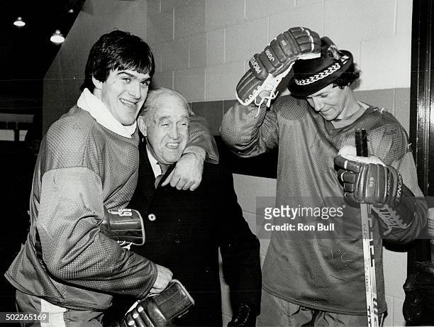 One of the boys: Maple Leafs players were always glad to see the King in the dressing room, and here he is a few years ago with a pait of ex-Leafs,...