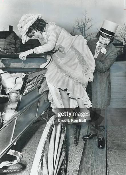 Love affair with the past; Dereck Turnbull helps his bride; Kate Williams; board an 1850 horse-drawn carriage after their wedding Saturday in Black...