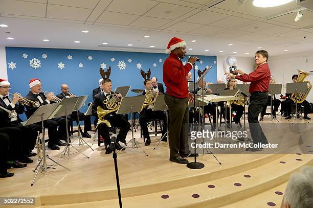 Boston Pops Conductor Keith Lockhart and Troy Brown, New England Patriots Alumnus and guest reader, perform at Boston Children's Hospital December...