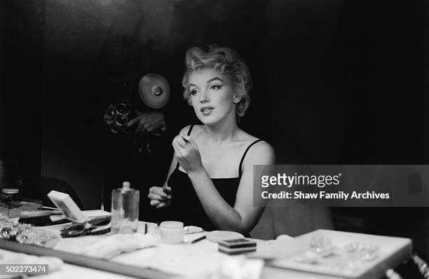 Marilyn Monroe at a makeup table getting ready for an event in 1955 in New York, New York.