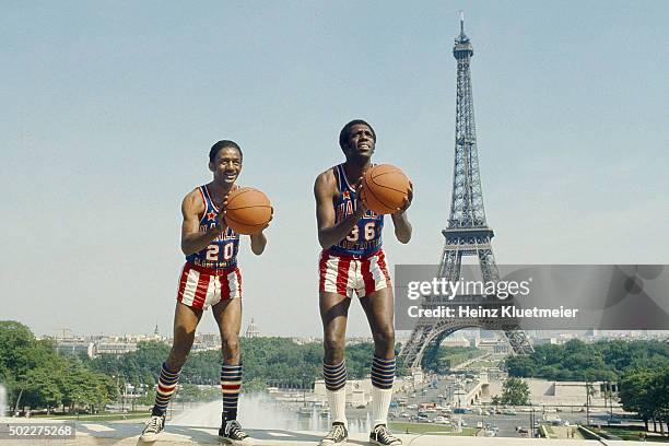 Portrait of Harlem Globetrotters Marques Haynes and Meadowlark Lemon posing during photo shoot at Jardins du Trocadero. View of Eiffel Tower in...