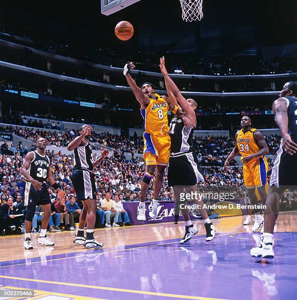 Kobe Bryant of the Los Angeles Lakers shoots against the San Antonio Spurs on December 25, 1999 at the Staples Center in Los Angeles California. NOTE...