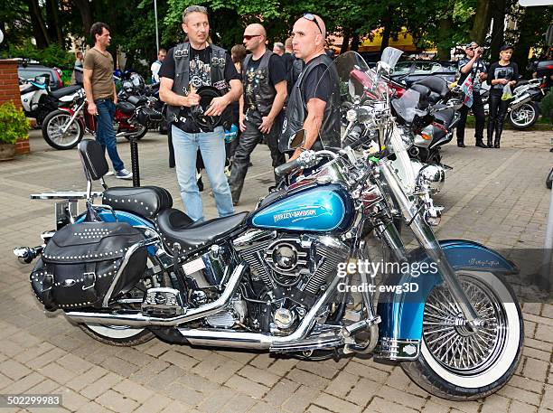 bikers and blue harley davidson motorcycle - harley guy stock pictures, royalty-free photos & images