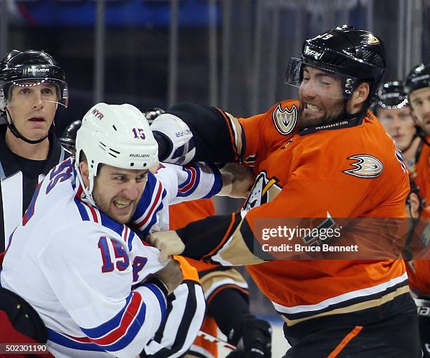 Tanner Glass of the New York Rangers fights with Patrick Maroon of the Anaheim Ducks during the first period at Madison Square Garden on December 22,...