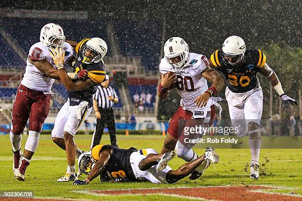 Kip Patton of the Temple Owls rushes for a touchdown during the fourth quarter of the game against the Toledo Rockets at FAU Stadium on December 22,...