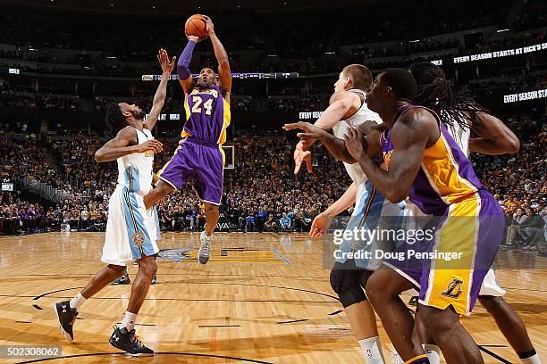 Kobe Bryant of the Los Angeles Lakers takes a shot over Will Barton of the Denver Nuggets at Pepsi Center on December 22, 2015 in Denver, Colorado....