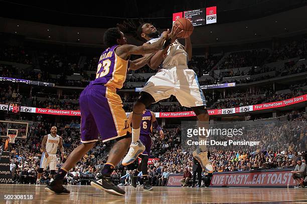 Kenneth Faried of the Denver Nuggets is fouled by Louis Williams of the Los Angeles Lakers as he tries to take a shot at Pepsi Center on December 22,...