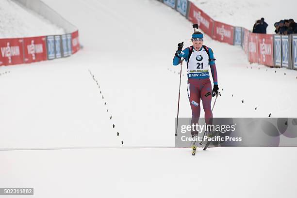 Olga Podchufarova from Russia crossing finish line at women 12,5 km mass start at Biathlon World Cup race.