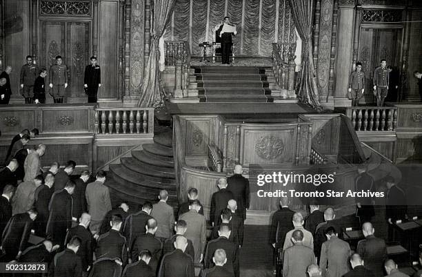 Heads bowed; members of the Japanese parliament listen while Emperior Hirohito reads an Imperial decree at the opening session of the diet in the...