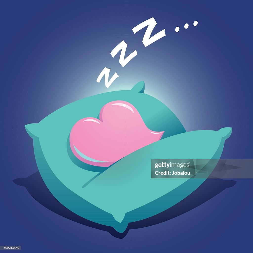 Coração de dormir em uma almofada