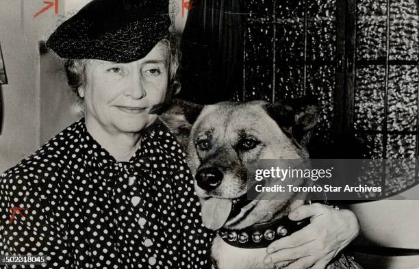 Barkless dog for Helen Keller. Helen Keller; amous mute and blind lecturer; has a new seeing eye. She is shown arriving at San Francisco with the...