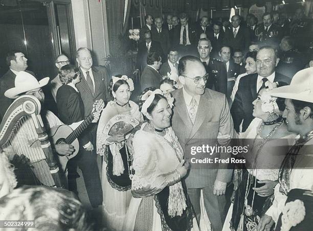 Mexican President Luis Echeverria is surrounded by dancers from Vera Cruz; Mexico; on his arrival at the Royal York Saturday. Echeverria addressed a...