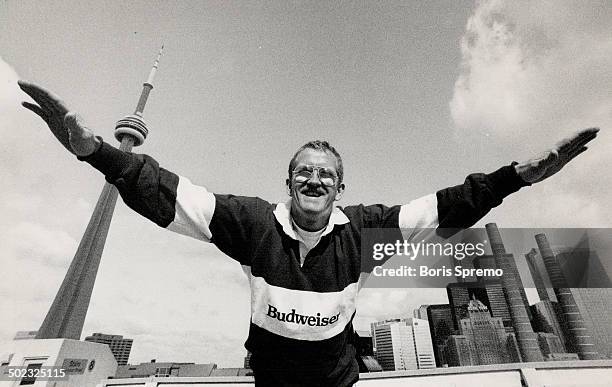 Britain's Eddie Edwards; spectacularly last in ski jumping at Calgary Olympics; leaps tall buildings in a single bound while on visit to Toronto...