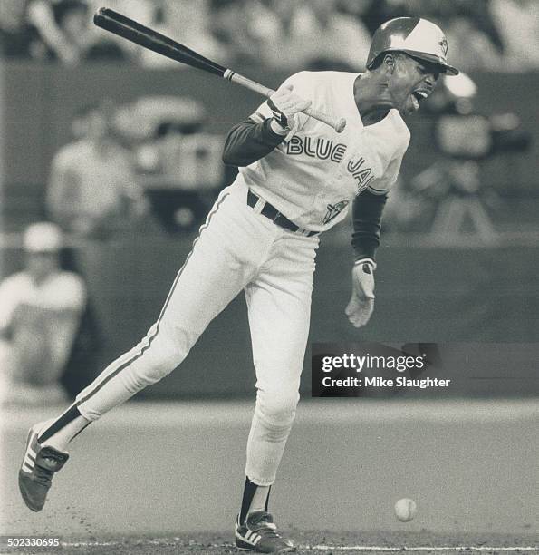 Beginning and the end: Blue Jays shortstop Tony Fernandez grimaces after a pitch hit him in the posterior in the first inning of last night's game...