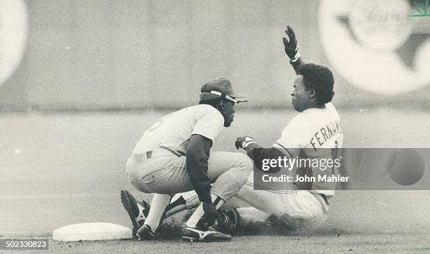 Making it happen: Tony Fernandez's speed on the base paths produces the Blue Jays' third run in the fifth inning. After singling; Fernandez streaked...