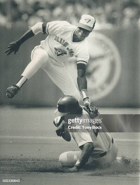 Theft thwarted: Jays shortstop Tony Fernandez puts the tag on Ivan Calderon; snuffing out a Chicago rally in the third inning yesterday at Exhibition...