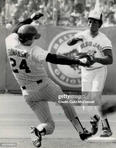 Hands up: Twins' Tom Brunansky could be forgiven if he felt that Blue Jays shortstop Tony Fernandez came a little too close for comfort with his...