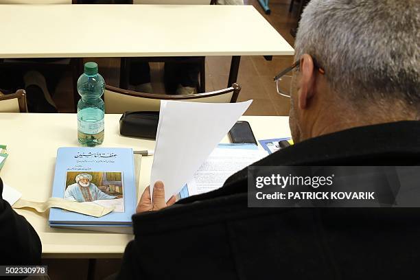 Man takes a theology training class for future imams and clerics at the Al-Ghazali institute of the Grand Mosque of Paris on December 19, 2015. / AFP...