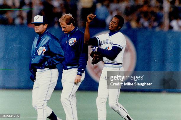 Serious loss: Toronto shortstop Tony Fernandez walks off the field holding his elbow that was fractured against the Tigers. His loss; particularly on...