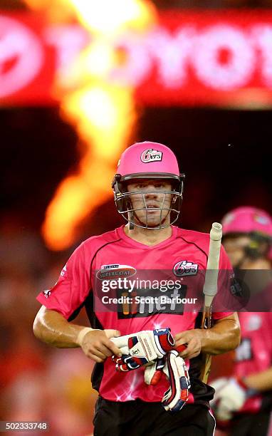 Moises Henriques of the Sixers leaves the field after being dismissed during the Big Bash League match between the Melbourne Renegades and the Sydney...