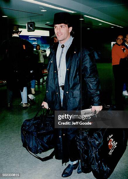 Dapper Doug arrives. Calgary quaterback Doug Flutie; bedecked in his all-black cowboy gear a Ia Johnny Cash; leads the Stampeder contingent's arrival...