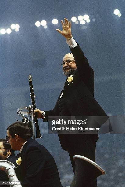 Super Bowl XV: Celebrity musician Pete Fountain holding clarinet while performing and waving to the crowd during halftime of Oakland Raiders vs...