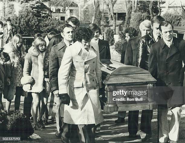 Last farewell: Carrying Tim Horton's casket to burial plot in York Cemetery yesterday are pall bearers Dave Keon; Bobby Baun; Allan Stanley; Billy...