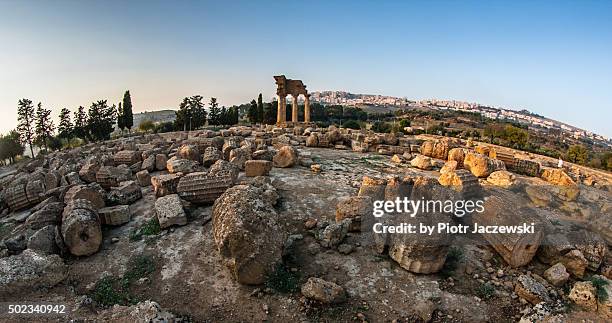 castor and pollux ruins - agrigento stockfoto's en -beelden