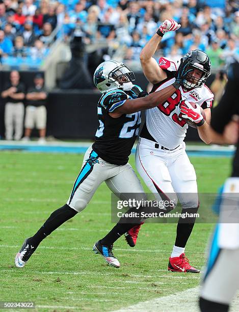 Bene Benwikere of the Carolina Panthers forces Jacob Tamme of the Atlanta Falcons out of bounds at Bank Of America Stadium on December 13, 2015 in...