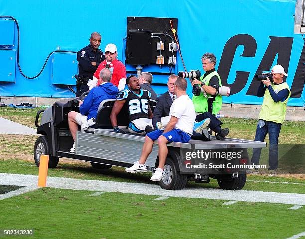 Bene Benwikere of the Carolina Panthers is carried off the field after breaking his leg against the Atlanta Falcons at Bank Of America Stadium on...