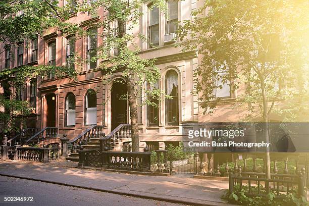 brownstones in a quiet residential street in manhattan, new york city - upper east side manhattan stock pictures, royalty-free photos & images