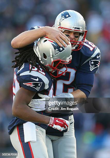 Tom Brady of the New England Patriots celebrates with Keshawn Martin after throwing a touchdown pass to James White during the second quarter against...