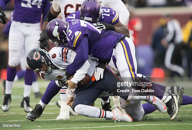 Sharrif Floyd of the Minnesota Vikings sacks Jay Cutler of the Chicago Bears during an NFL game against the Chicago Bears at TCF Bank Stadium...