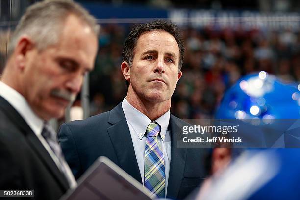 Assistant coach Doug Lidster of the Vancouver Canucks looks on from the bench during their NHL game against the Dallas Stars at Rogers Arena December...