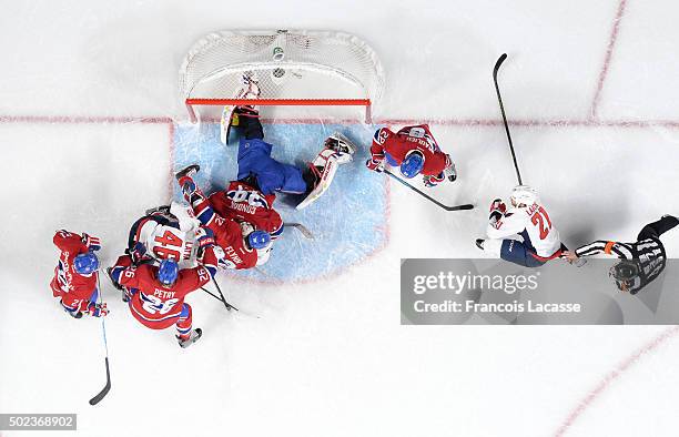 Mike Condon of the Montreal Canadiens blocks a shot by Brooks Laich of the Washington Capitals in the NHL game at the Bell Centre on December 3, 2015...