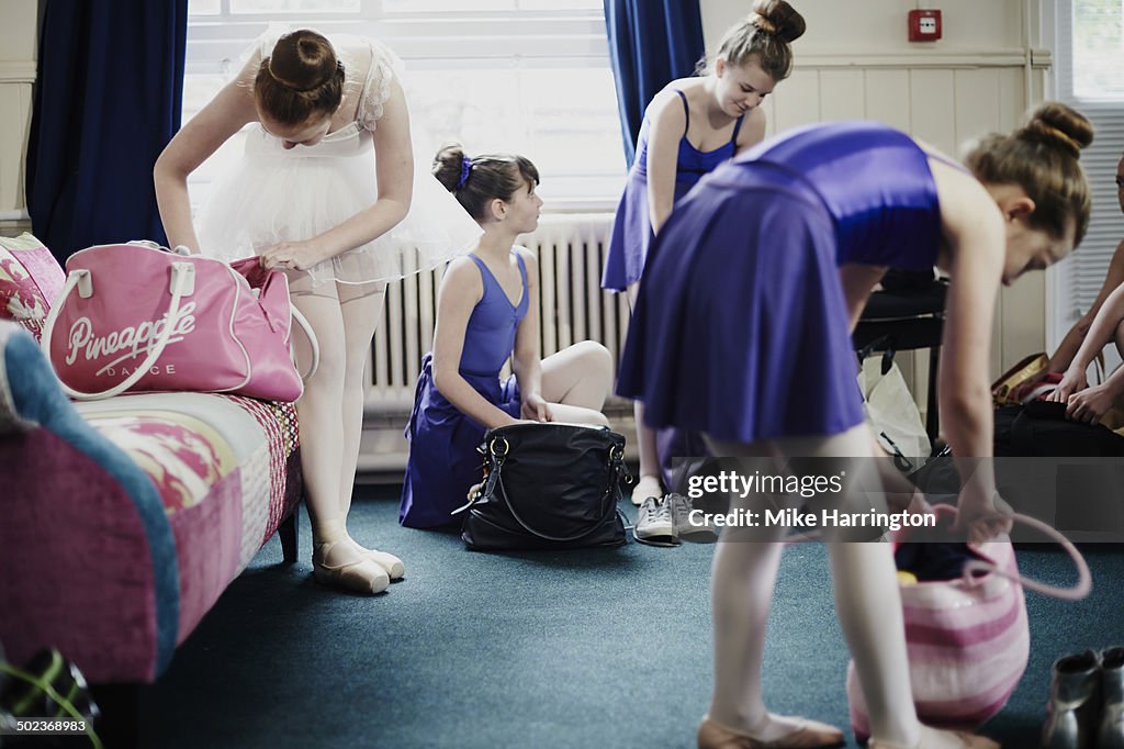 Ballet dancers preparing to go home after lesson